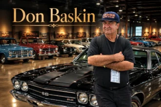 Don Baskin car collection featuring classic American muscle cars, vintage vehicles, and commercial trucks in a large warehouse.