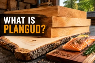 Plangud Estonian wood planks stacked in a rustic workshop beside a cedar grilling board and hand tools